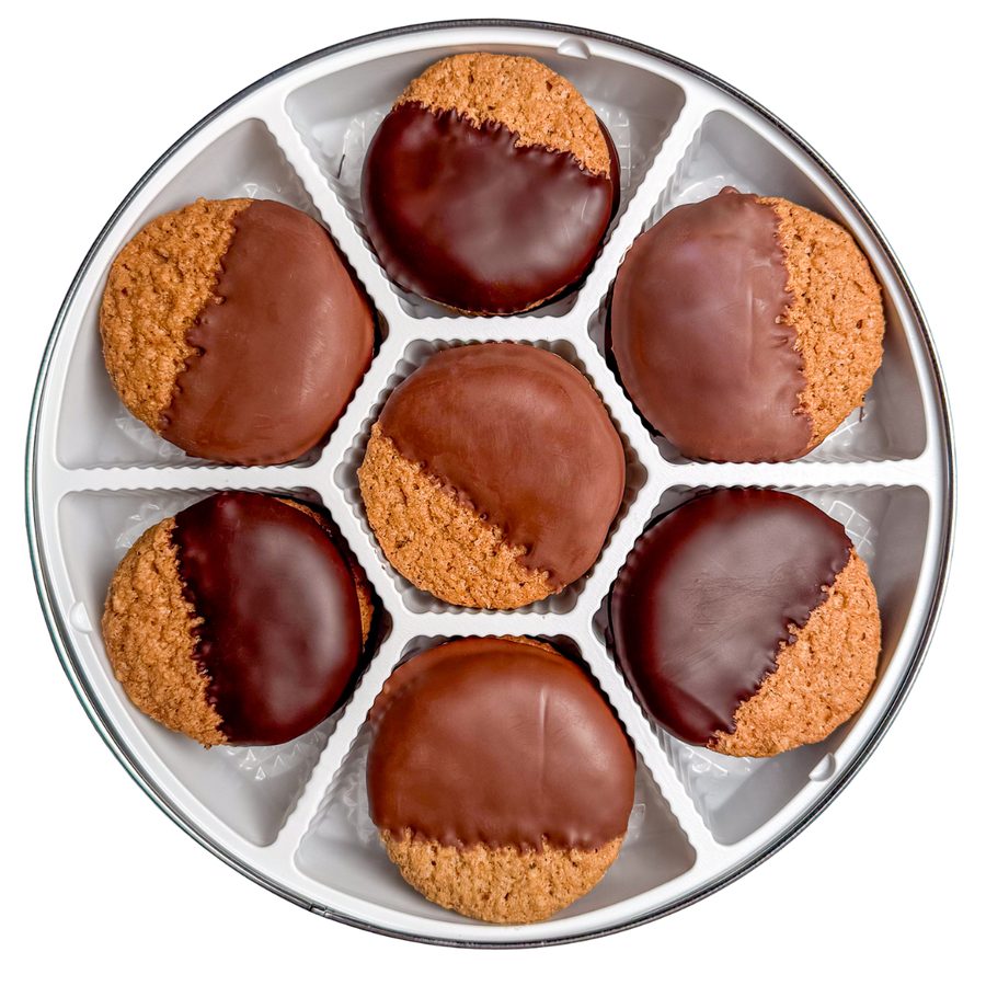 Large tin of chocolate-dipped cookies, lid off